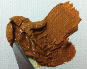 Figure 7: Williamsburg Raw Sienna squeezed from the tube, then sliced open after 1 year.