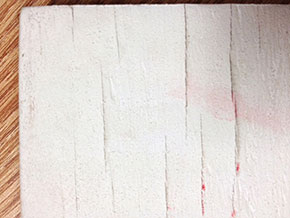 Surface checking on gessoed plywood.