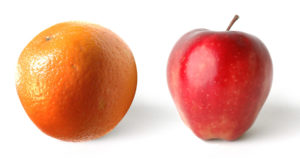 Apple and orange on a white background