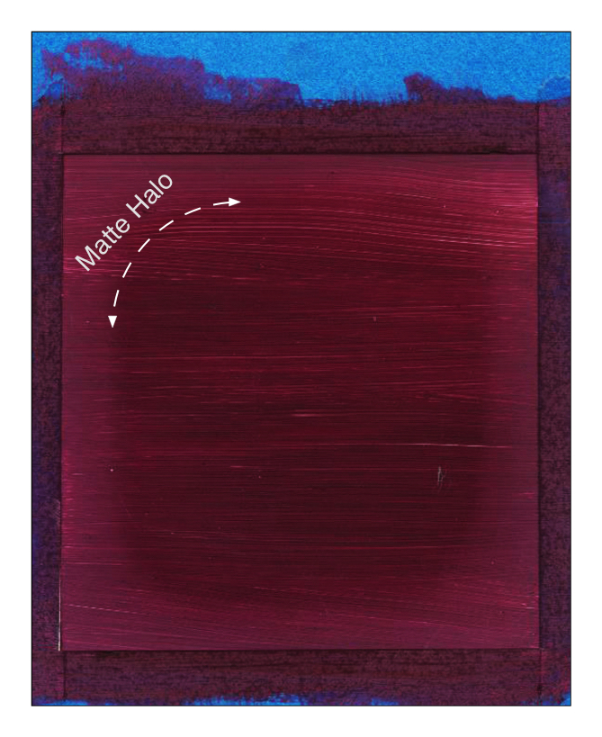 Example of a paint-out of Williamsburg Ultramarine Pink where a matte halo developed after being allowed to dry with the painter's tape in place.