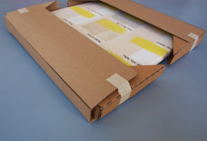 edge protection from cardboard rails placed over cardboard corner protection.