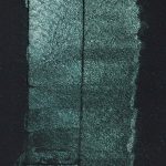 QoR Interference Green-Blue color shift watercolor lightfast test result photograph of a 10 water to 1 paint dilution on cold pressed black watercolor paper.